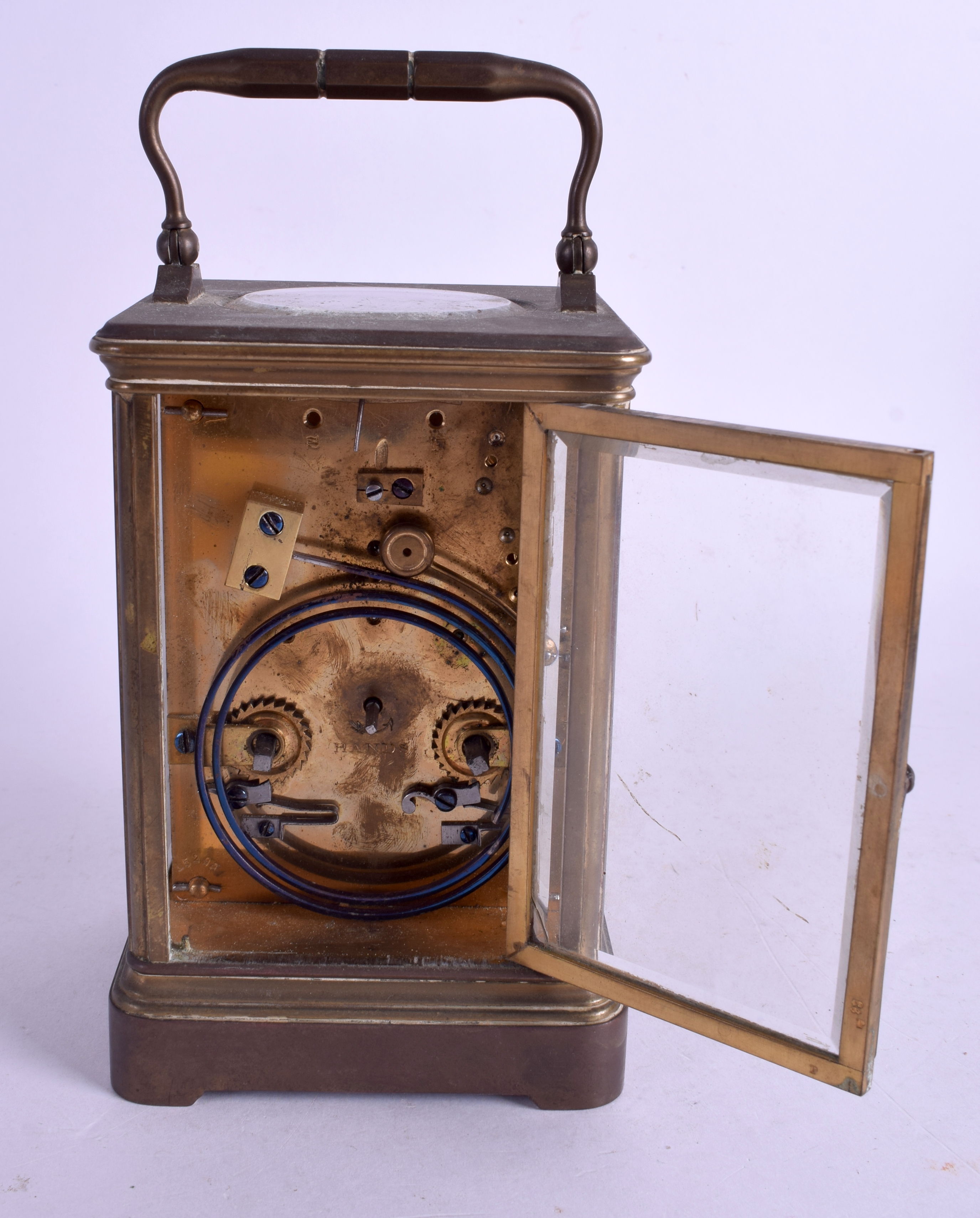 AN ANTIQUE TIFFANY & CO BRASS STRIKING CARRIAGE CLOCK. 17.5 cm high inc handle. - Image 3 of 4