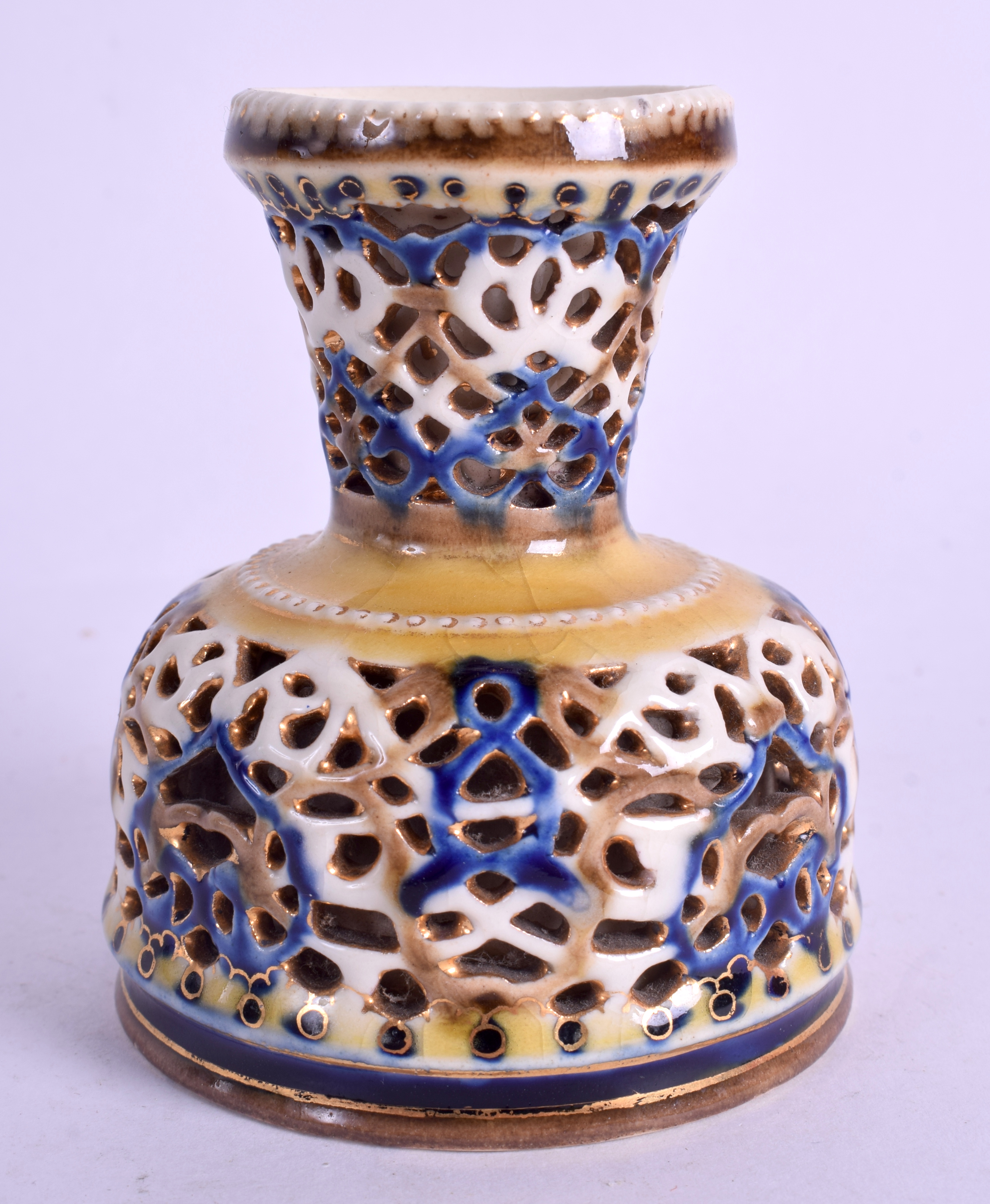 AN UNUSUAL ANTIQUE HUNGARIAN ZSOLNAY PECS RETICULATED VASE. 8 cm high.