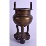 A 19TH CENTURY CHINESE GOLD SPLASH TWIN HANDLED BRONZE CENSER upon a fitted hardwood base. 12 cm x