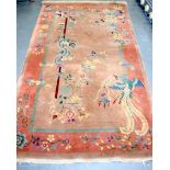 A CHINESE ART DECO RUG BY WANGU FU, decorated with a dragon and mythical bird, stamped underside. 2
