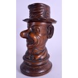 A LOVELY ANTIQUE TREEN FRUITWOOD TOBACCO SNUFF JAR AND COVER modelled as a male wearing a hat. 20 c