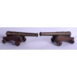 A PAIR OF ANTIQUE BRASS CANNONS. Barrel 32 cm long.