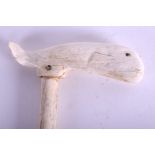 AN 18TH CENTURY CONTINENTAL CARVED WHALE BONE WALKING CANE formed with a large carved whale to the