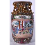 A LARGE MID 20TH CENTURY CHINESE FAMILLE ROSE PORCELAIN VASE, formed with gilt chilong handles and