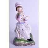 AN ANTIQUE CONTINENTAL PORCELAIN FIGURE OF A SEATED FEMALE possibly Russian, painted with floral sp