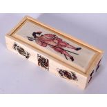 A BONE DOMINOES BOX, decorated with a guard and playing cards. 11 cm long.