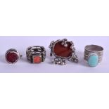 FOUR MIDDLE EASTERN SILVER RINGS inset with hardstones. 1.5 oz. (4)