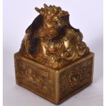 A LARGE CHINESE GILT BRONZE SEAL, formed with a dragon terminal, 20th century. 16 cm x 10 cm.