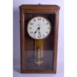 A 1950S ELECTRIC ATO OAK HANGING WALL CLOCK with circular dial. 46 cm x 24 cm.
