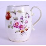 AN 18TH CENTURY DERBY EARLY BARREL SHAPED MUG painted with flowers, the internal firing crack wonde