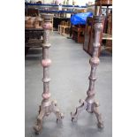 A LARGE PAIR OF WOODEN PRICKET CANDLESTICKS, formed upon three curved feet. 82 cm high.