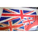 A LARGE UNITED KINGDOM UNION FLAG, together with two other antique flags. Largest 125 cm x 236 cm.
