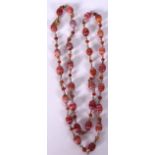 A MIDDLE EASTERN AGATE BEAD NECKLACE, banded, with smaller spherical spacers. 62 cm long.