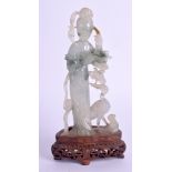 AN EARLY 20TH CENTURY CHINESE CARVED JADEITE FIGURE OF GUANYIN modelled beside a bird. Jadeite §13