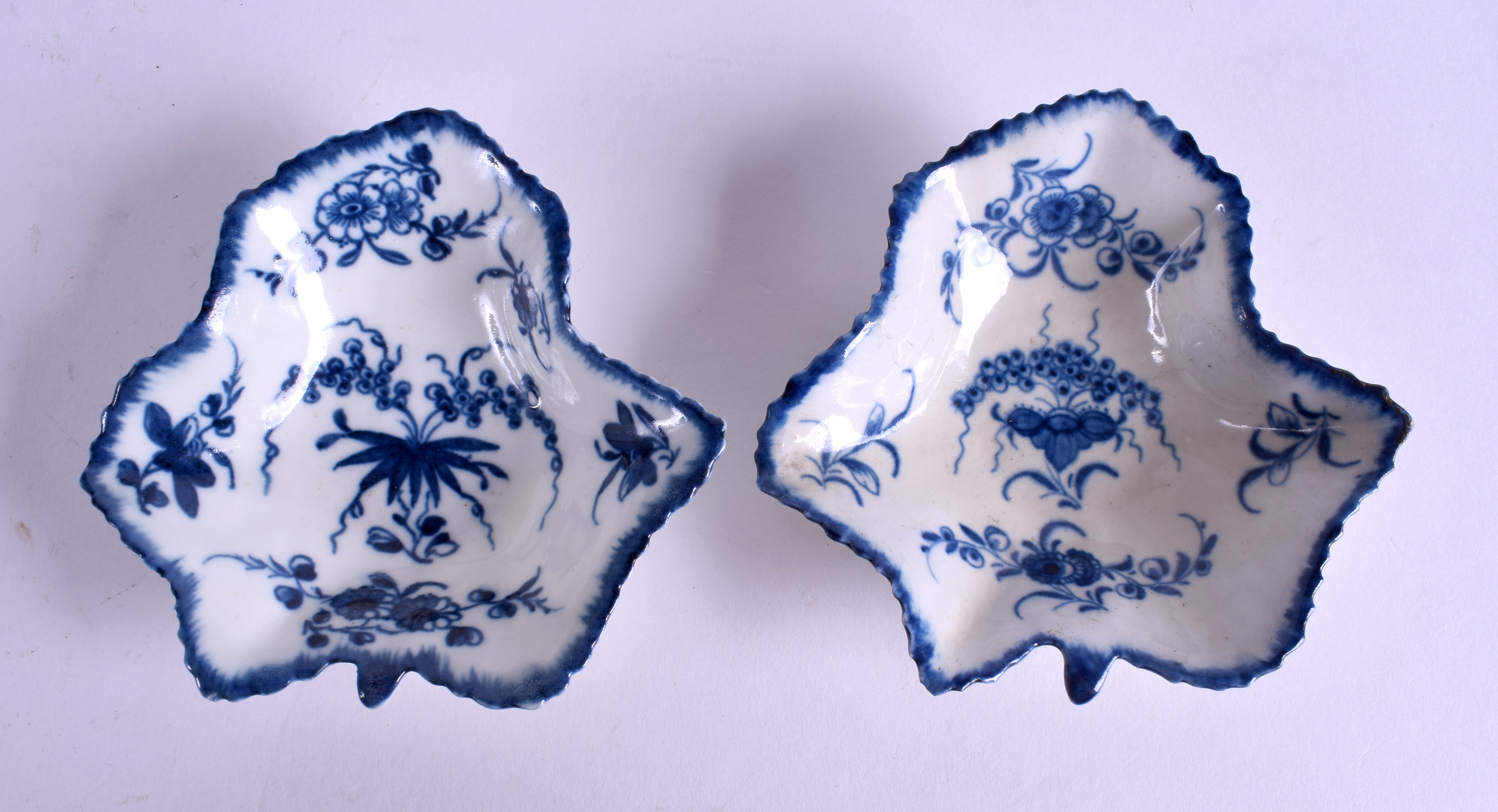 A PAIR OF 18TH CENTURY WORCESTER VINE LEAF PICKLE DISHES painted with different versions of the pat