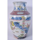 A CHINESE FAMILLE ROSE BLUE AND WHITE VASE 20th Century, painted with landscapes. 31 cm high.