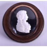 AN UNUSUAL 19TH CENTURY GOLD CAMEO AND LACQUER SNUFF BOX inset with a female portrait. 6 cm wide.