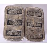 A PAIR OF CHINESE WHITE METAL INGOTS, bearing stamp. 5.5 cm wide.