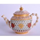 A MAJESTIC ROYAL WORCESTER RETICULATED PORCELAIN JEWELLED TEAPOT AND COVER Attributed to George Owe