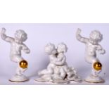 THREE GERMAN PORCELAIN FIGURINES, a pair balancing gilded spheres together with a similar group. Pa