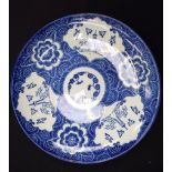 AN EARLY 20TH CENTURY JAPANESE BLUE AND WHITE DISH, painted with birds and foliage. 29cm diameter