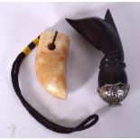 A CHINESE CARVED HARDSTONE PENDANT, together with a carved horn. Largest 9 cm. (2)