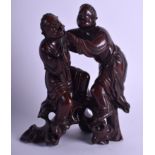 A LATE 19TH CENTURY CHINESE CARVED HARDWOOD FIGURE OF THE HEHE ERXIAN TWINS. 19 cm x 11 cm.