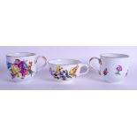 AN 18TH CENTURY MEISSEN TEACUP AND SAUCER together with two coffee cups and saucers, painted with b