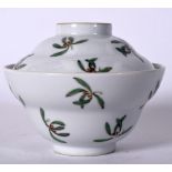 AN EARLY 20TH CENTURY CHINESE FAMILLE ROSE BOWL AND COVER, painted with floral sprays. 11 cm wide.
