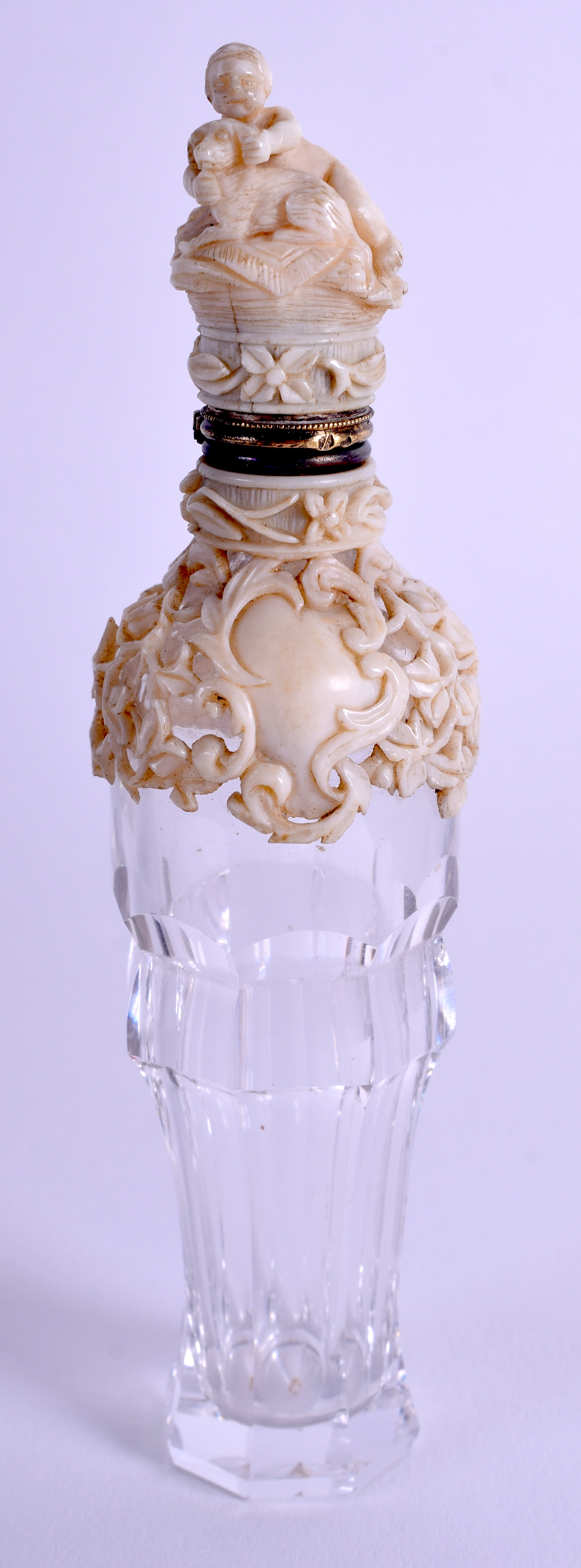 A RARE 19TH CENTURY CONTINENTAL DIEPPE IVORY AND GLASS SCENT BOTTLE overlaid with foliage. 11 cm hi