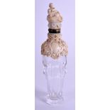 A RARE 19TH CENTURY CONTINENTAL DIEPPE IVORY AND GLASS SCENT BOTTLE overlaid with foliage. 11 cm hi