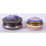 AN ANTIQUE SILVER AND ENAMEL CIRCULAR PILL BOX painted with a female amongst clouds, together with
