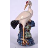 A CHINESE ROBINS EGG GLAZED FIGURE OF A STORK, modelled standing upon a rocky outcrop. 27 cm high.