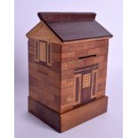 AN UNUSUAL VINTAGE MULTI WOOD NOVELTY MONEY BOX in the form of a house. 15 cm x 9 cm.