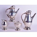 A STYLISH ARTS AND CRAFTS STERLING SILVER FOUR PIECE TEASET in the manner of Georg Jensen. 84 oz. L
