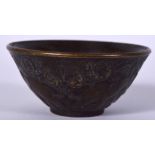 A 20TH CENTURY CHINESE BRONZE BOWL, decorated in relief with elephants in a landscape, signed. 6 cm
