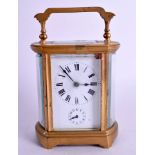AN ANTIQUE FRENCH BRASS ALARM CARRIAGE CLOCK. 14 cm high inc handle.
