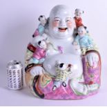 A VERY LARGE CHINESE REPUBLICAN PERIOD FAMILLE ROSE BUDDHA overlaid with five children. 36 cm x 28
