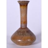 A ROMAN UNGUENTARIUM GLASS BOTTLE VASE, formed with a bulbous body and flared neck. 9 cm high.