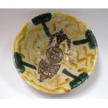 AN ISLAMIC PERSIAN POTTERY BOWL, painted with symbols. 22.5 cm wide.