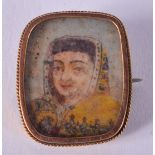 AN ANTIQUE GOLD AND IVORY MINIATURE. 2 cm x 2.25 cm.