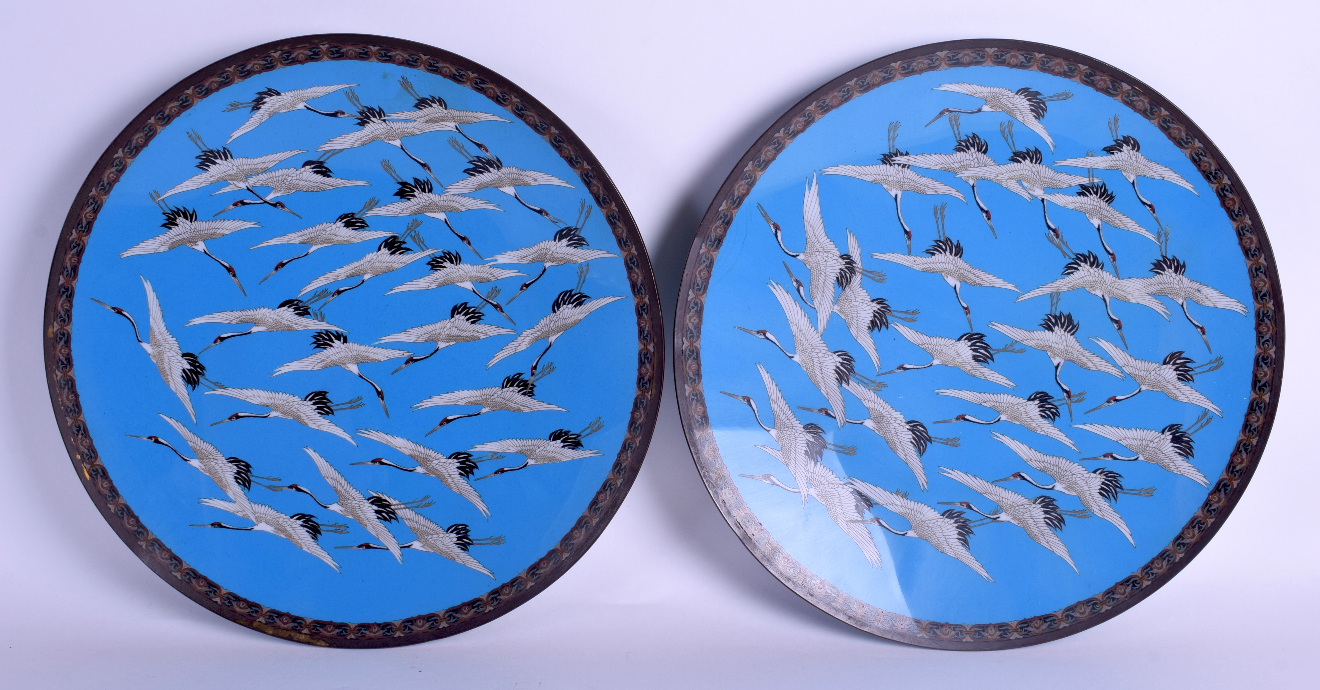 A GOOD PAIR OF 19TH CENTURY JAPANESE MEIJI PERIOD CLOISONNE ENAMEL DISHES decorated with cranes in