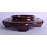 A 19TH CENTURY CHINESE CARVED HONGMU HARDWOOD VASE STAND Qing. 23 cm wide, internal diameter 20 cm.