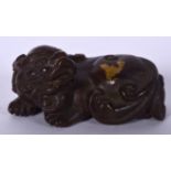 A CHINESE GOLD SPLASH BRONZE SCROLL WEIGHT, in the form of a mythical beast. 7 cm wide.