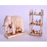 A 19TH CENTURY INDIAN CARVED IVORY ELEPHANT together with a carved bone prisoner of war dumb waiter