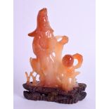 A FINE LATE 19TH CENTURY CHINESE CARVED AGATE FIGURE OF GUANYIN modelled beside a child. Agate 7 cm
