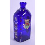 A VINTAGE SWEDISH ENAMELLED BLUE GLASS BOTTLE decorated with an armorial crest. 15 cm high.
