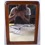 AN ANTIQUE MAHOGANY MIRROR, formed with rounded corners. 38 cm x 28 cm.