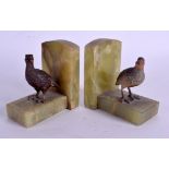 A PAIR OF EARLY 20TH CENTURY AUSTRIAN COLD PAINTED BRONZE AND ONYX BOOKENDS. 9 cm x 11 cm.