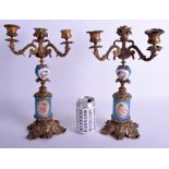 A PAIR OF 19TH CENTURY SEVRES PORCELAIN TRIPLE BRANCH CANDELABRA. 35 cm x 17 cm.